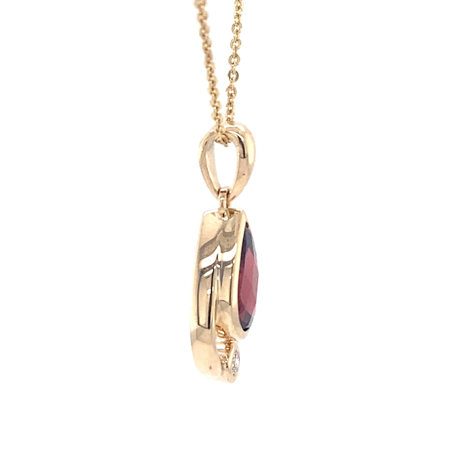 Pear shaped garnet and round brilliant cut diamond pendant Gardiner Brothers