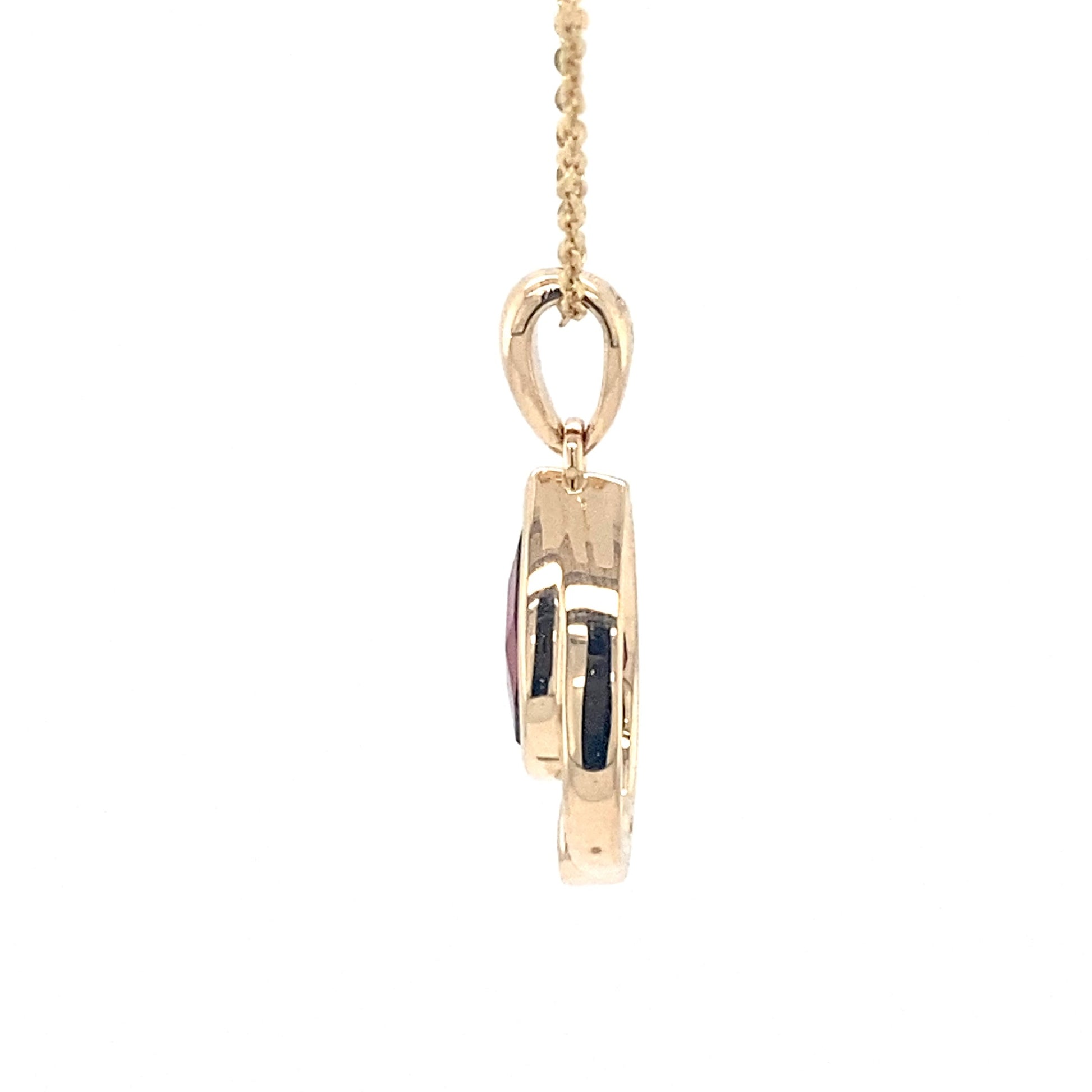 Pear shaped garnet and round brilliant cut diamond pendant Gardiner Brothers