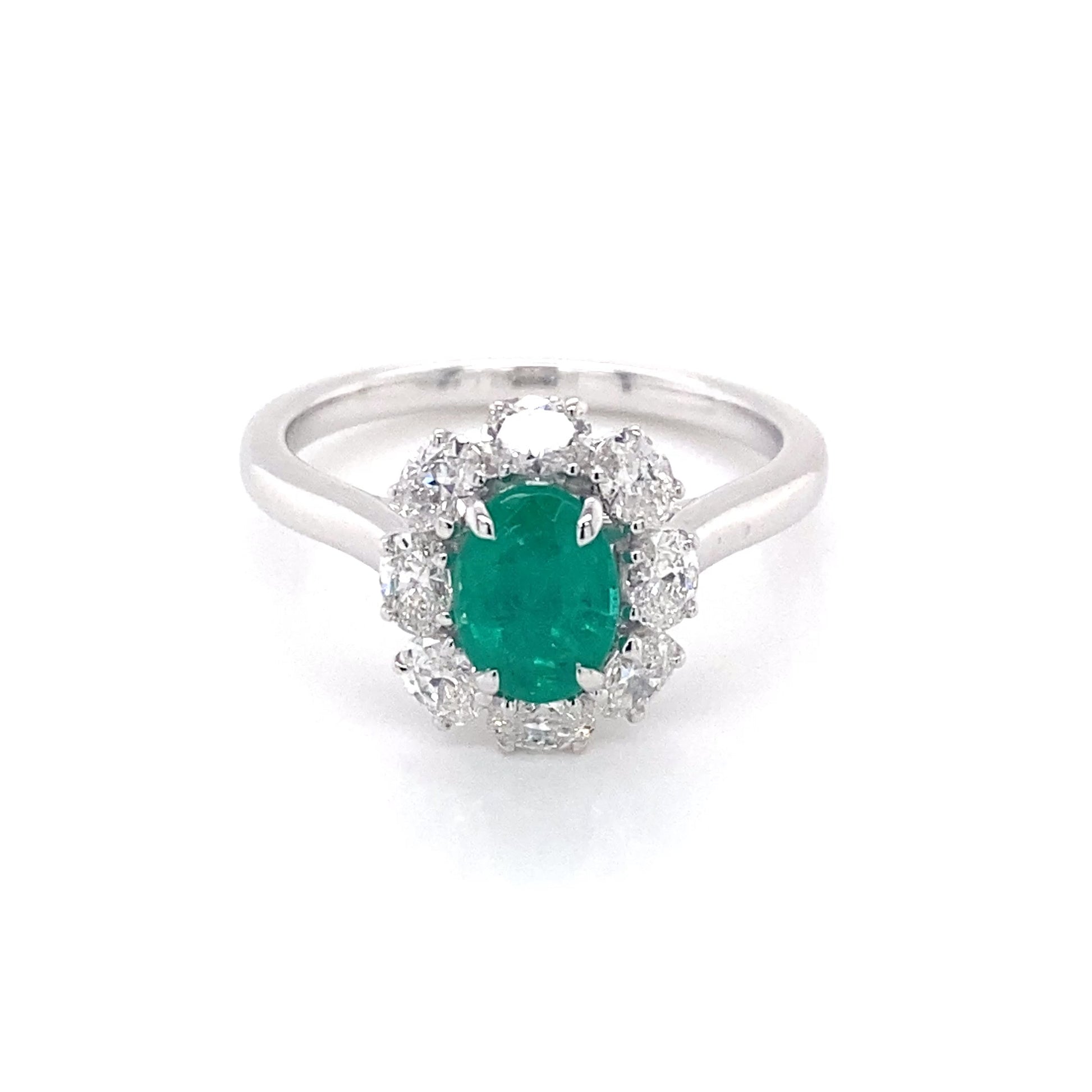 Oval shaped emerald and oval diamond cluster style ring Gardiner Brothers