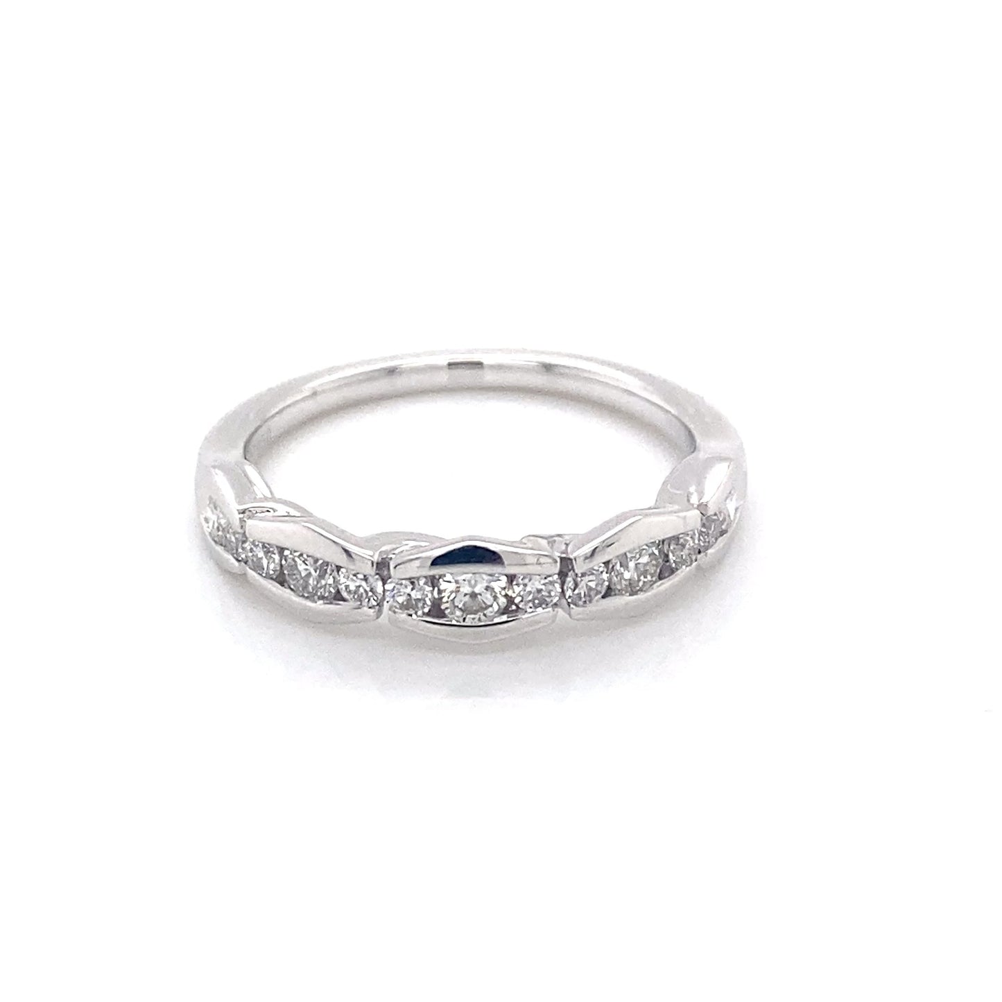 Platinum round brilliant cut diamond alternating size eternity ring Gardiner Brothers