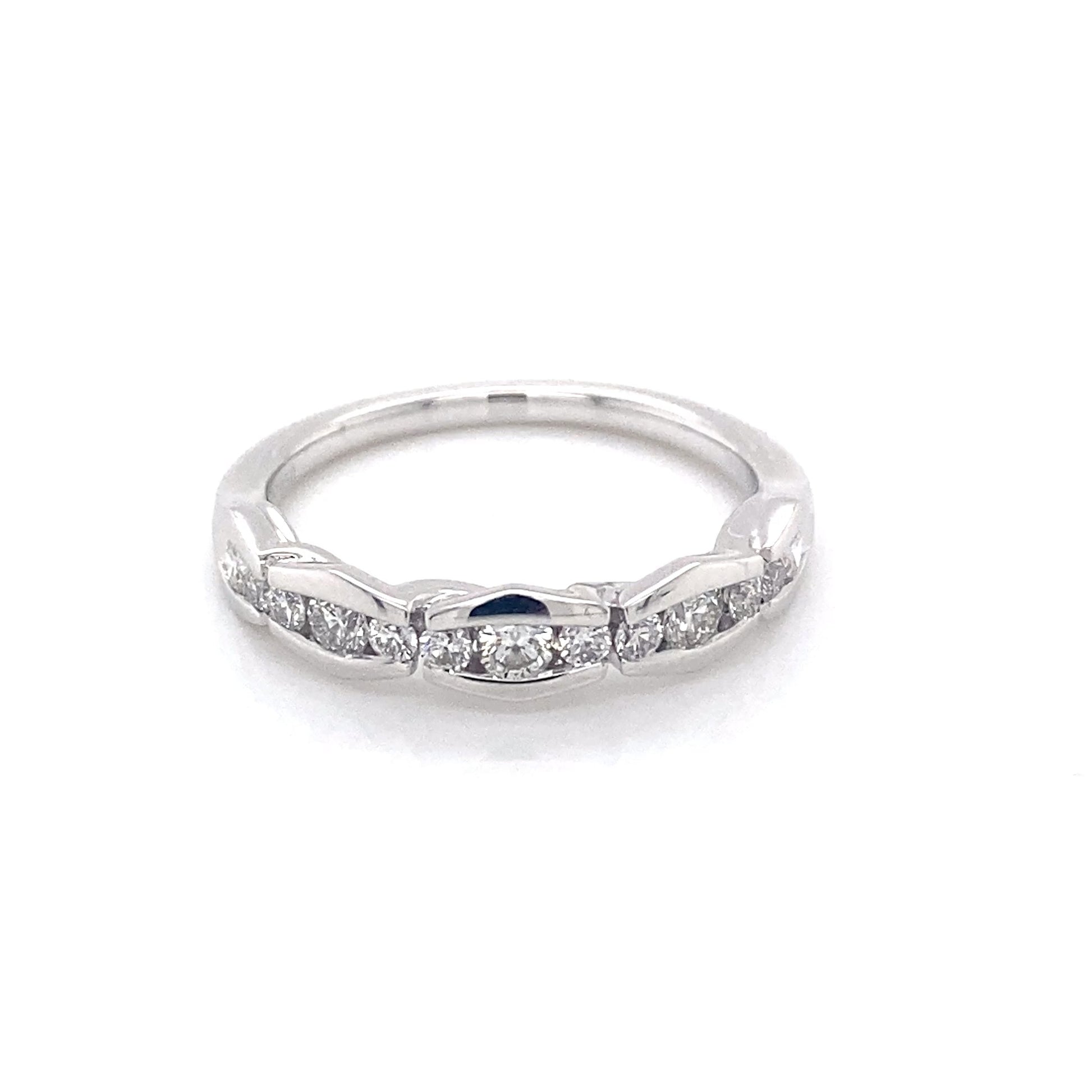 Platinum round brilliant cut diamond alternating size eternity ring Gardiner Brothers