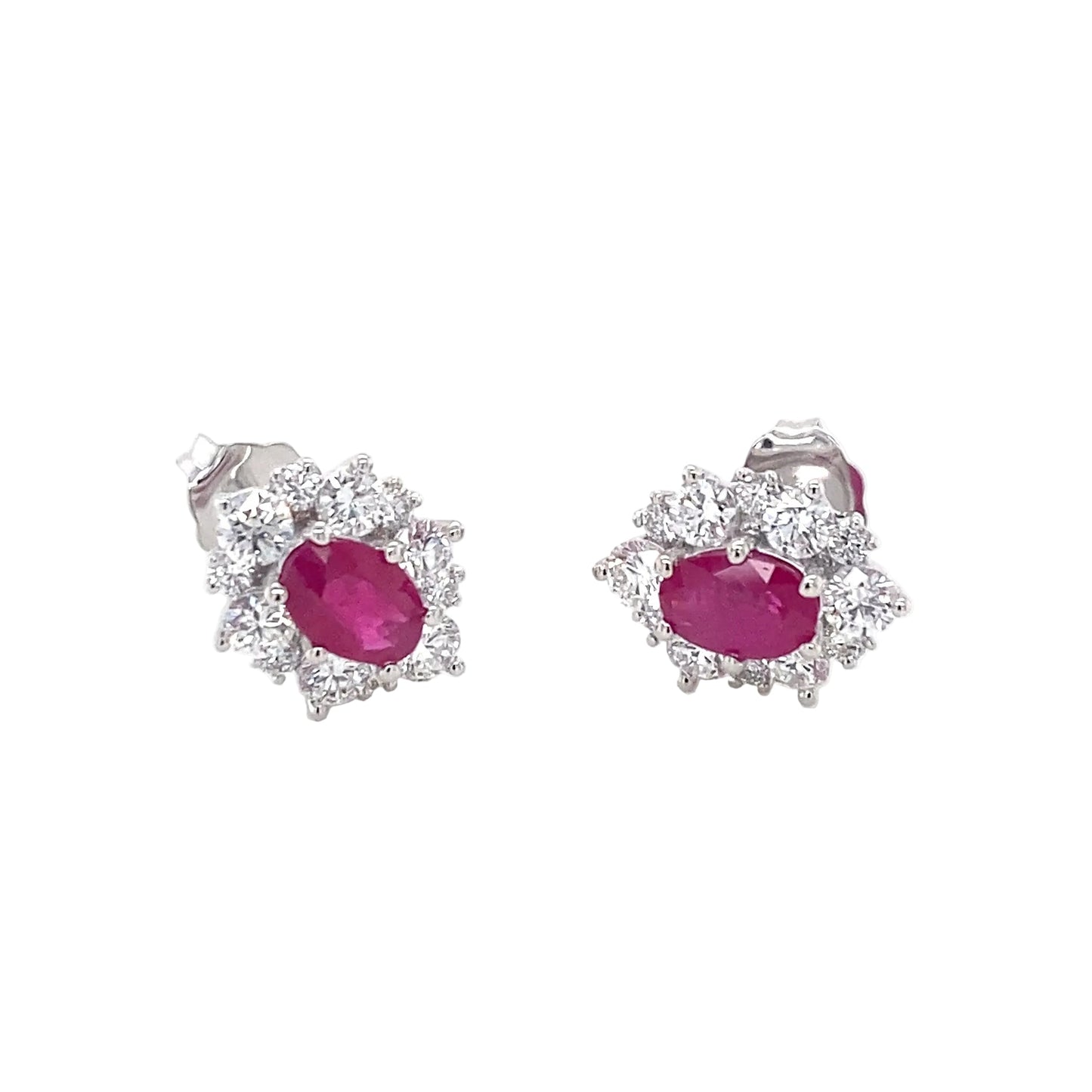 Oval Shaped Ruby and round brilliant cut diamond cluster style earrings Gardiner Brothers