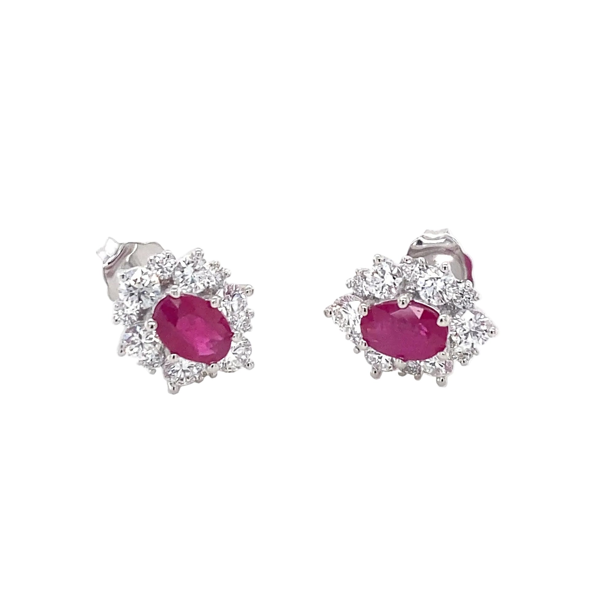 Oval Shaped Ruby and round brilliant cut diamond cluster style earrings Gardiner Brothers