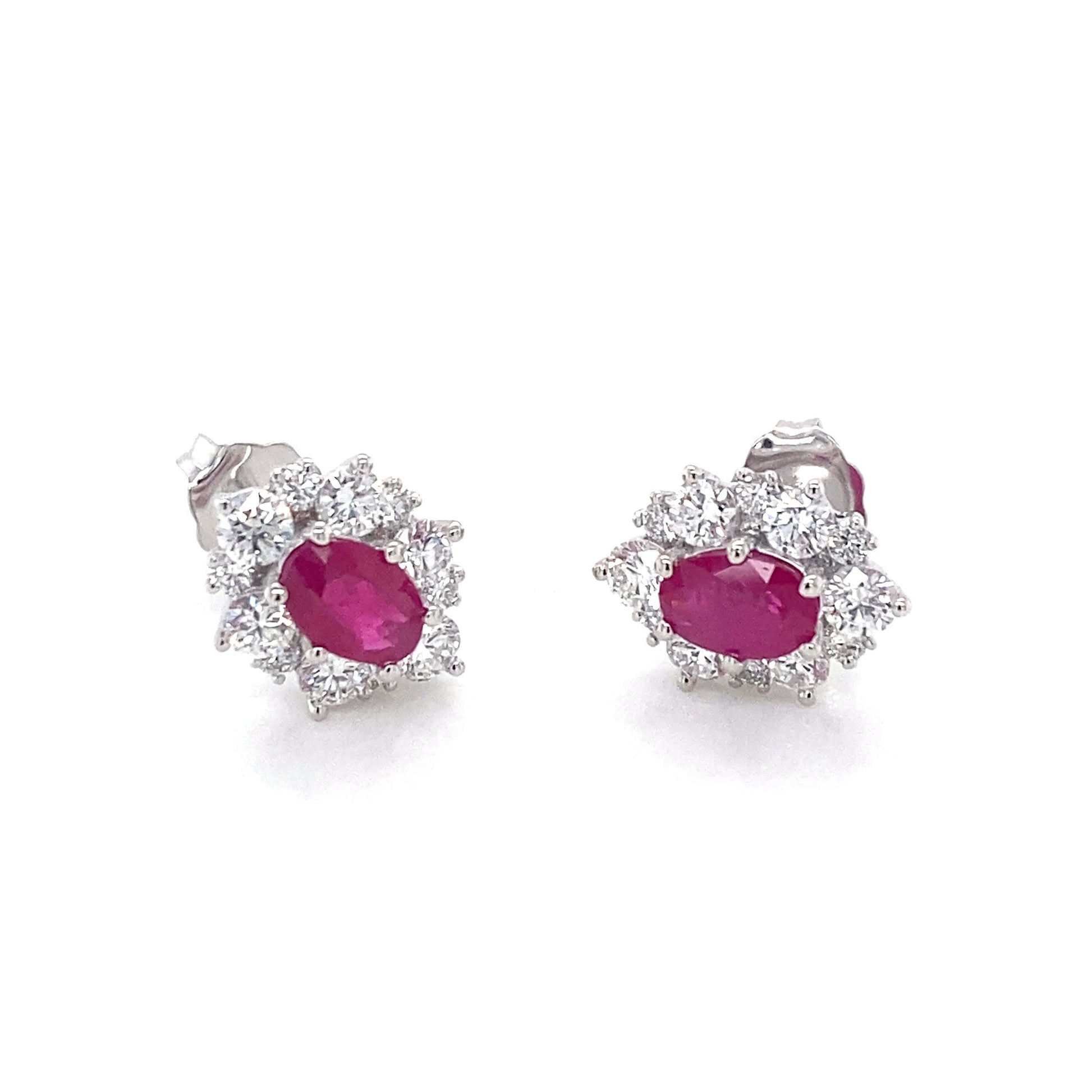 Oval Shaped Ruby and round brilliant cut diamond cluster style earrings Gardiner Brothers