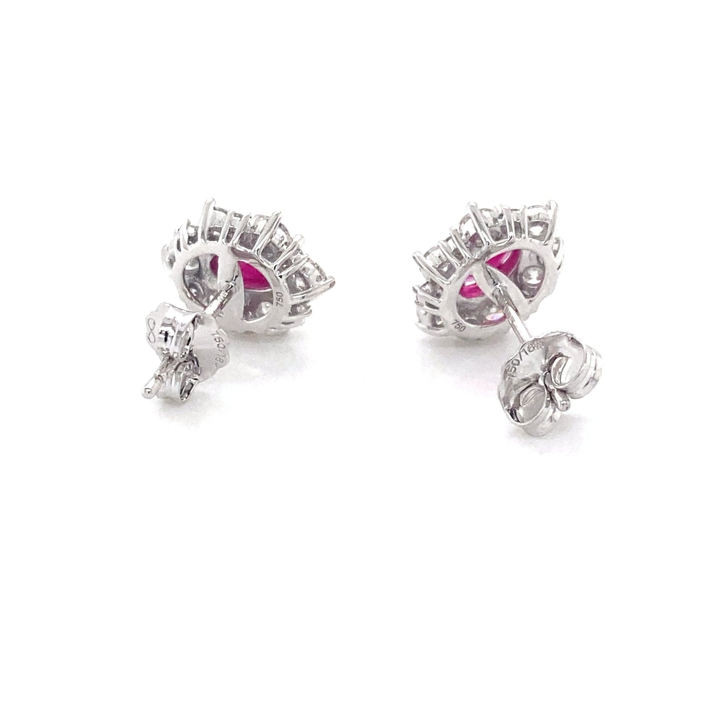 Oval Shaped Ruby and round brilliant cut diamond cluster style earrings Gardiner Brothers