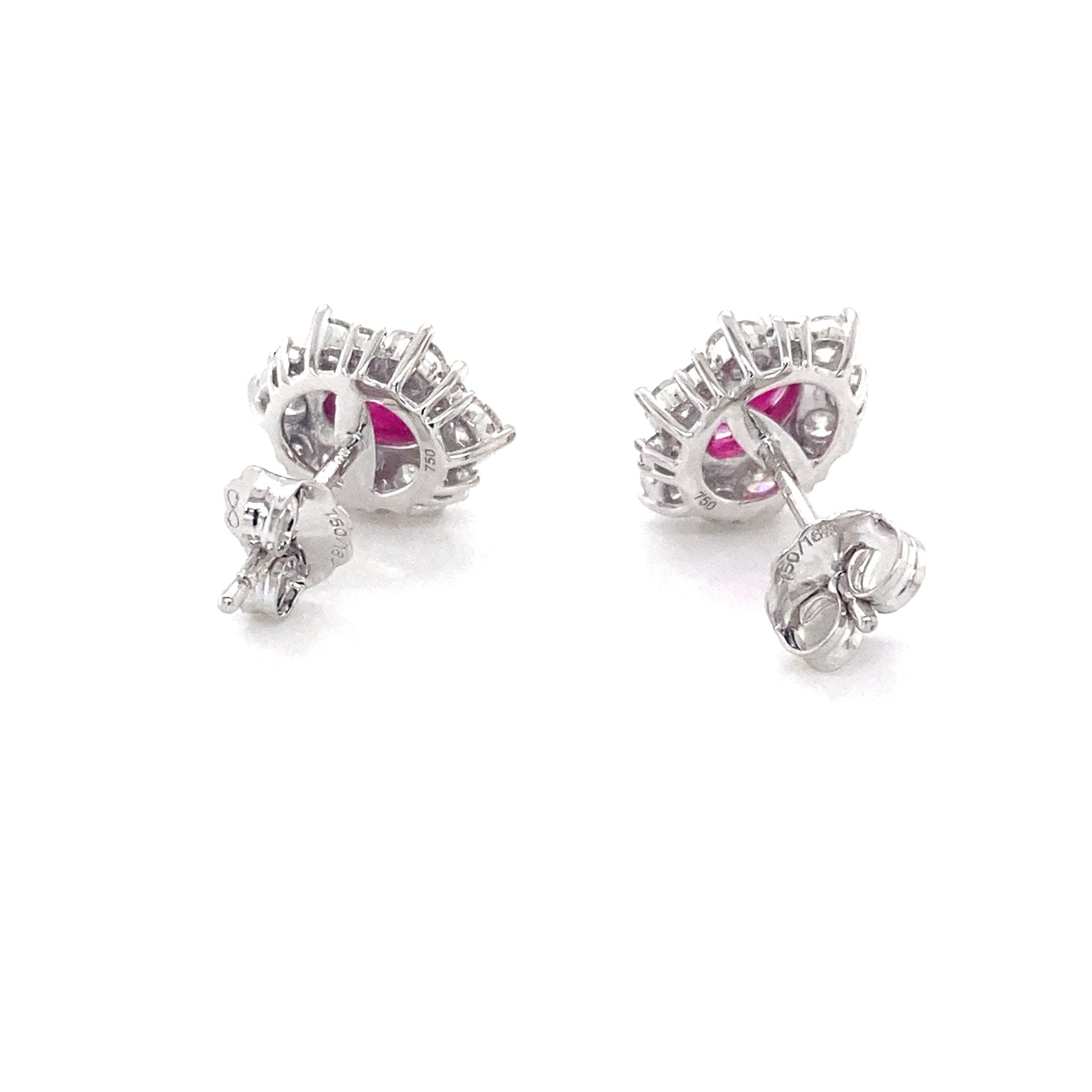 Oval Shaped Ruby and round brilliant cut diamond cluster style earrings Gardiner Brothers