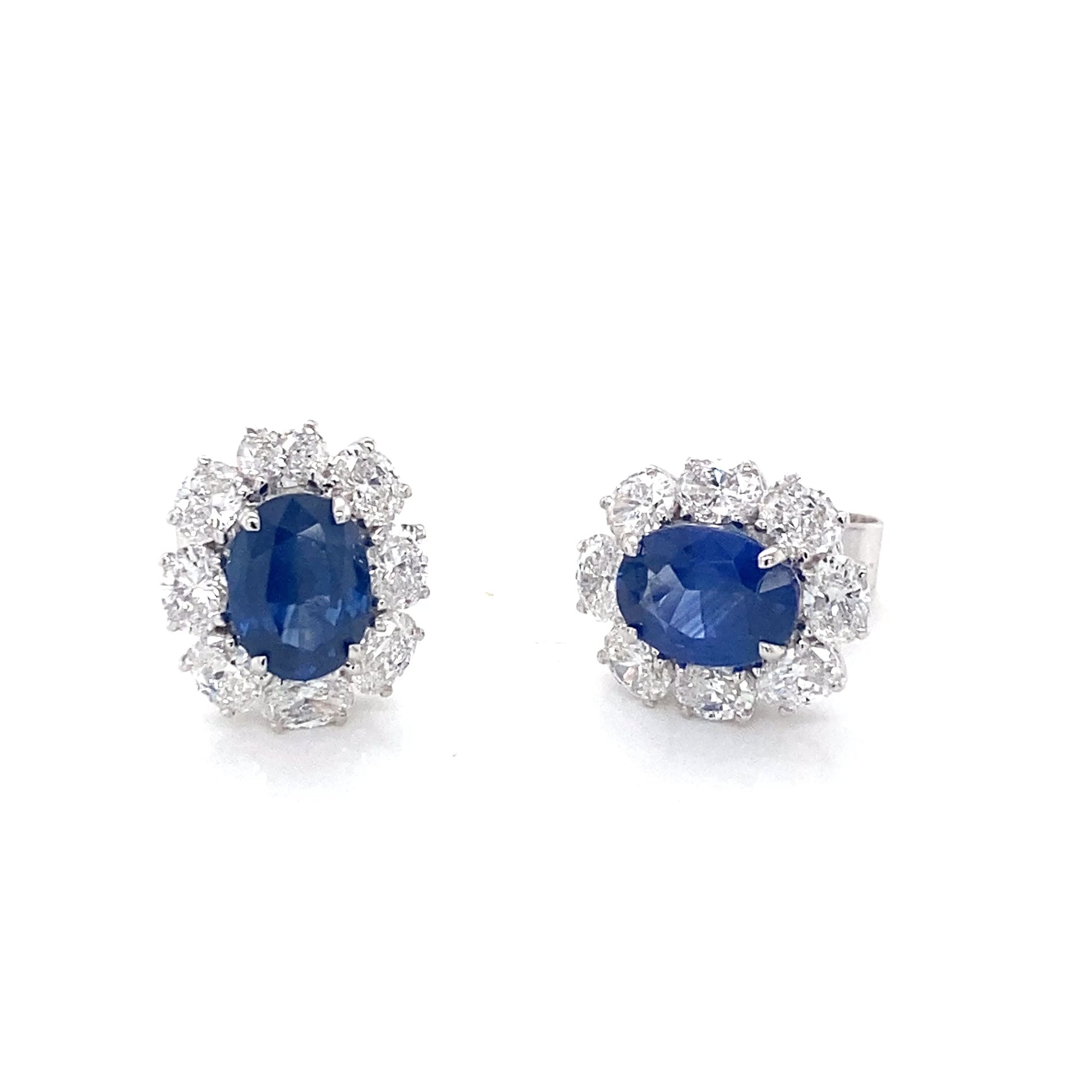 Oval Shaped Sapphire and oval shaped diamond cluster style earrings Gardiner Brothers