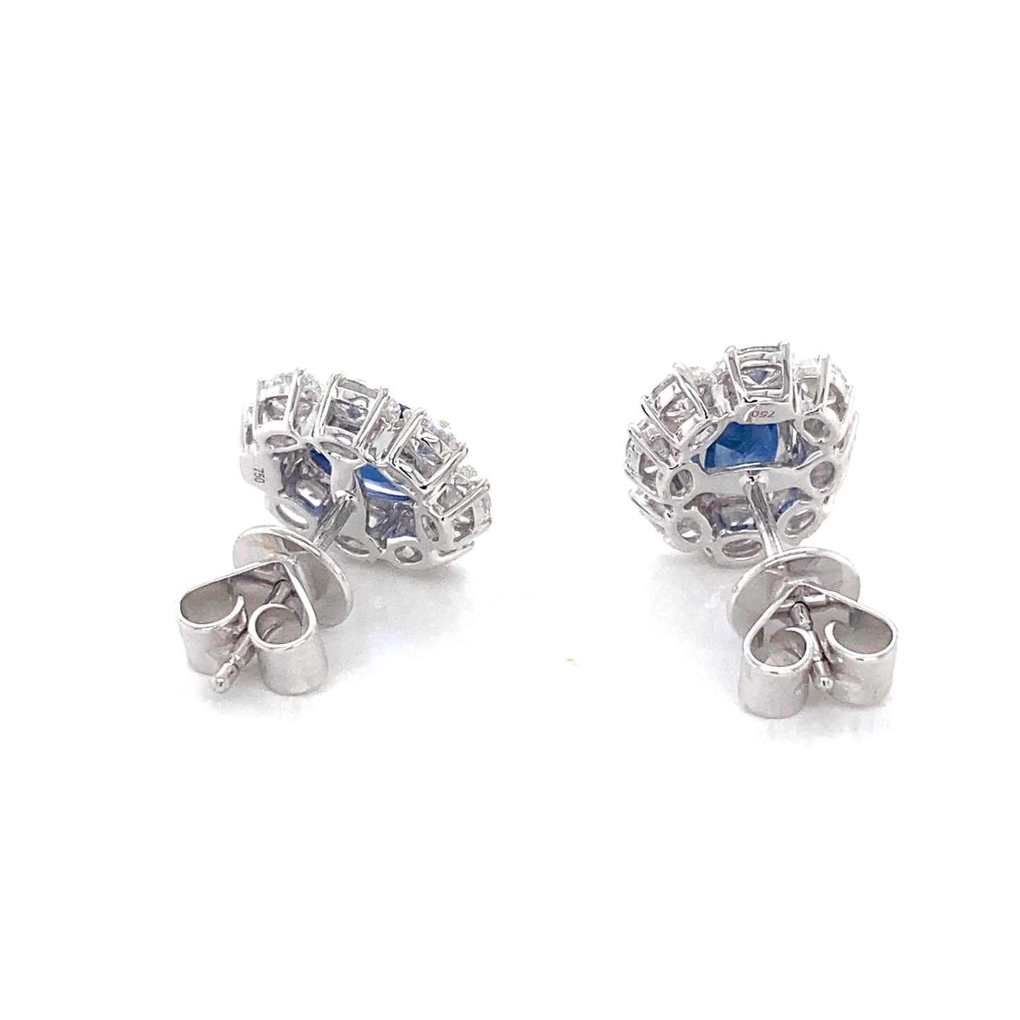 Oval Shaped Sapphire and oval shaped diamond cluster style earrings Gardiner Brothers