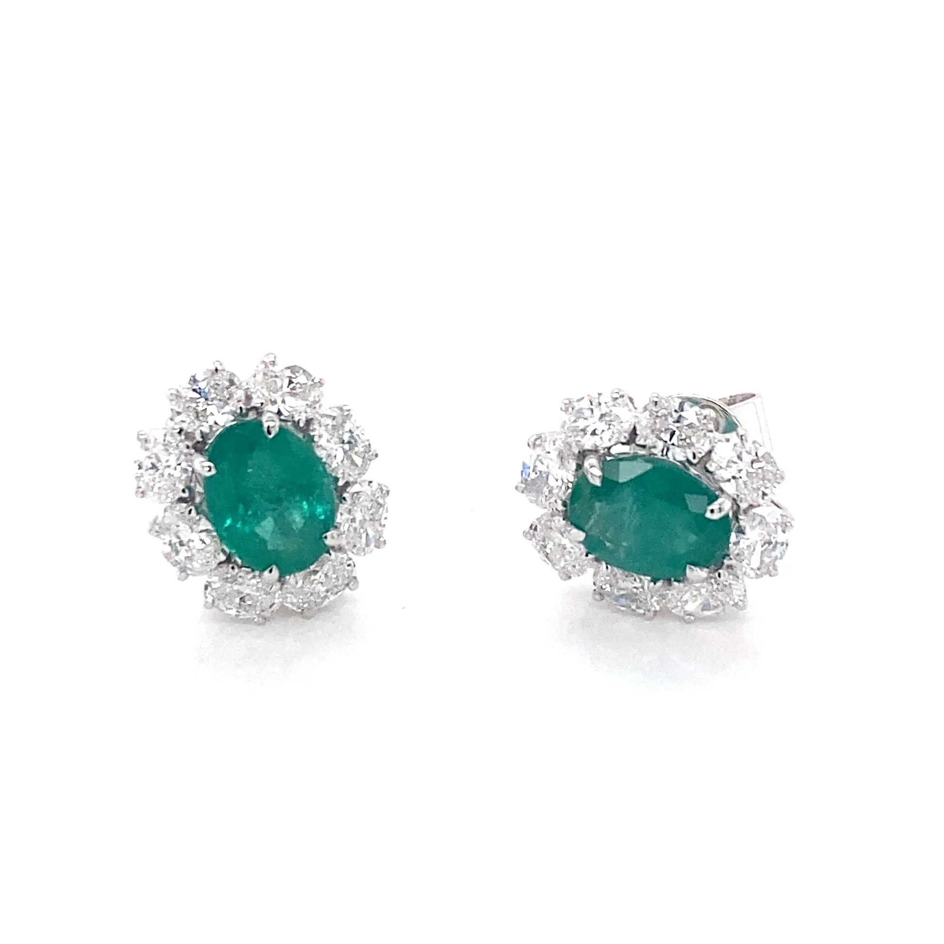 Oval shaped emerald and oval diamonds cluster style earrings Gardiner Brothers