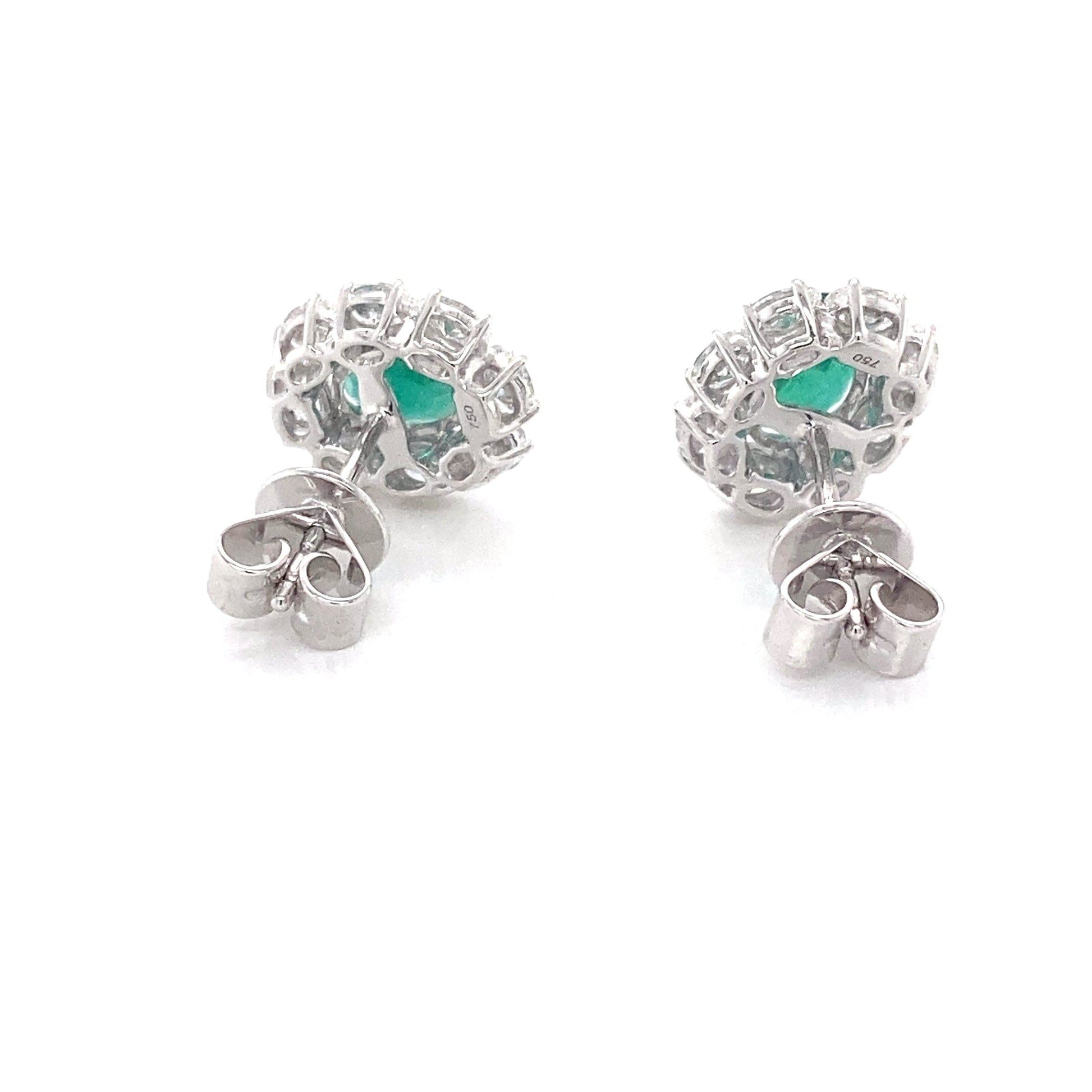 Oval shaped emerald and oval diamonds cluster style earrings Gardiner Brothers