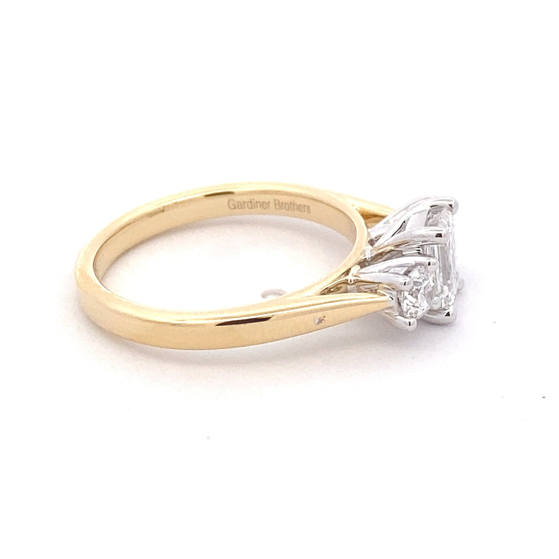 Yellow Gold Emerald and round brilliant cut diamond 3 stone ring - 1.03cts Gardiner Brothers