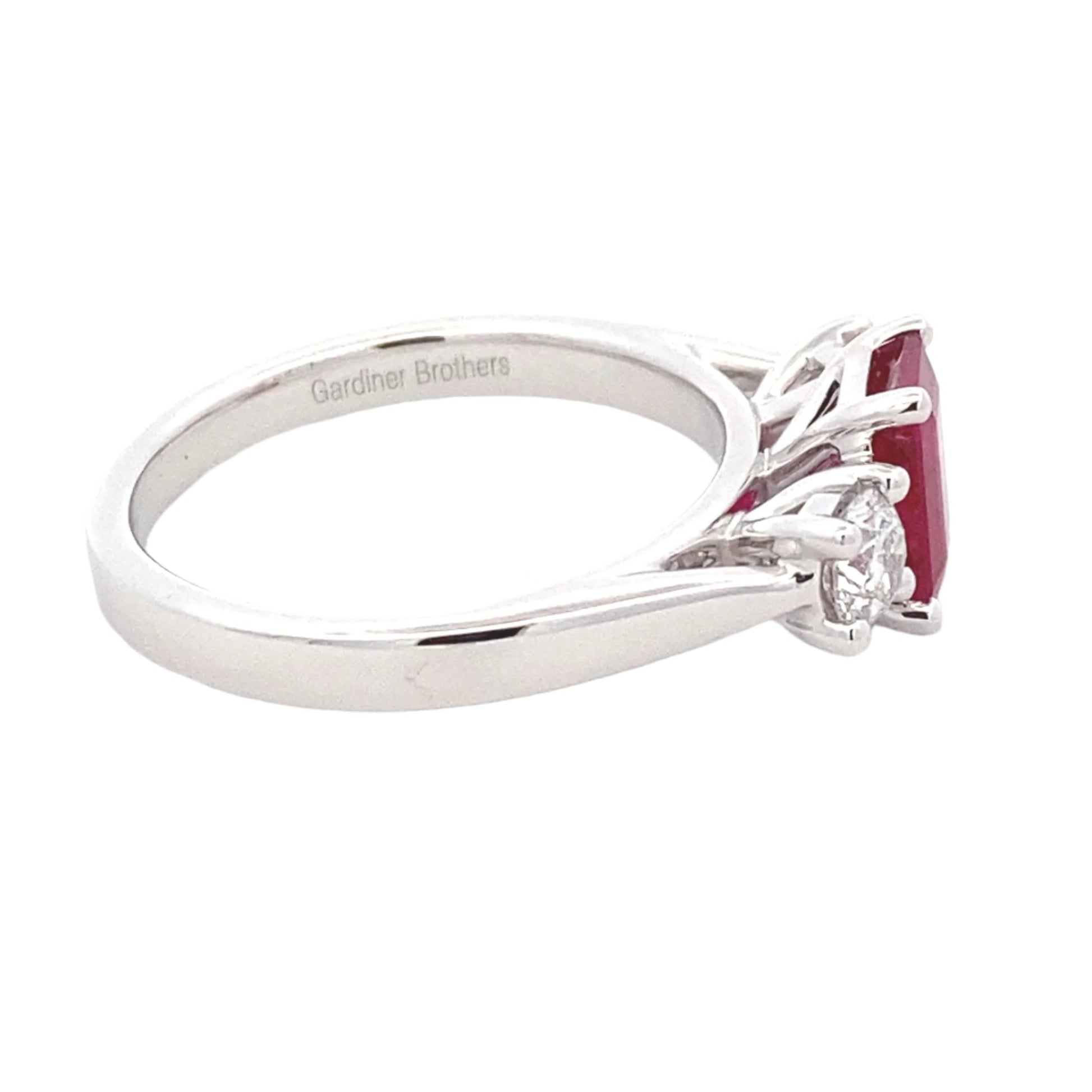 Octagonal Ruby and round brilliant cut diamond 3 stone ring Gardiner Brothers