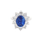 Oval Shaped Sapphire and round brilliant cut diamond traditional cluster ring Gardiner Brothers