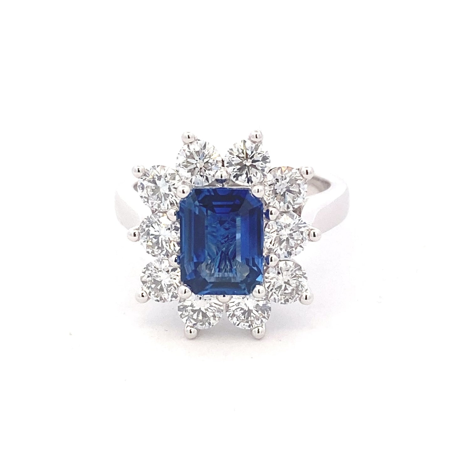 Octagonal shaped sapphire and round brilliant cut diamond cluster style ring Gardiner Brothers