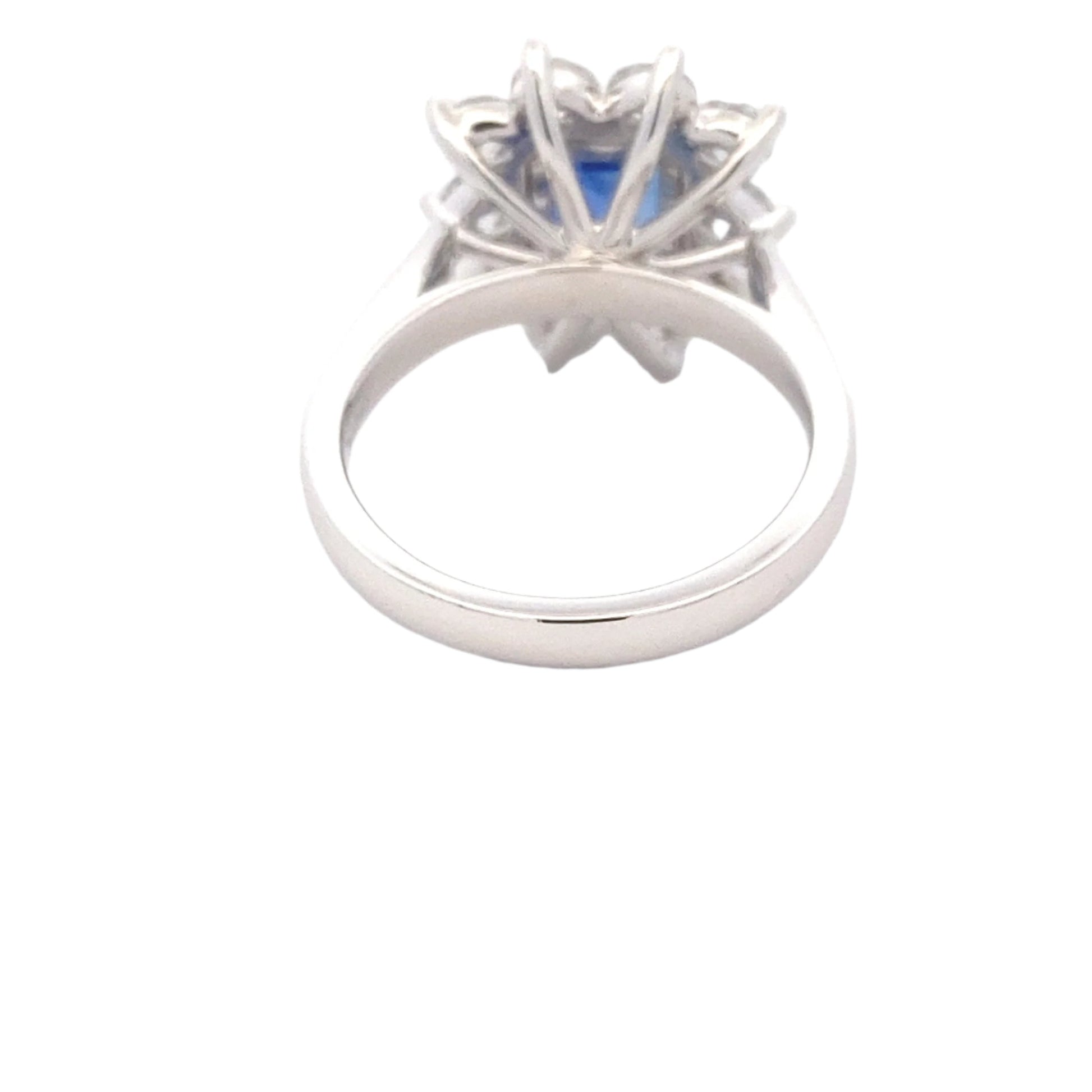 Octagonal shaped sapphire and round brilliant cut diamond cluster style ring Gardiner Brothers