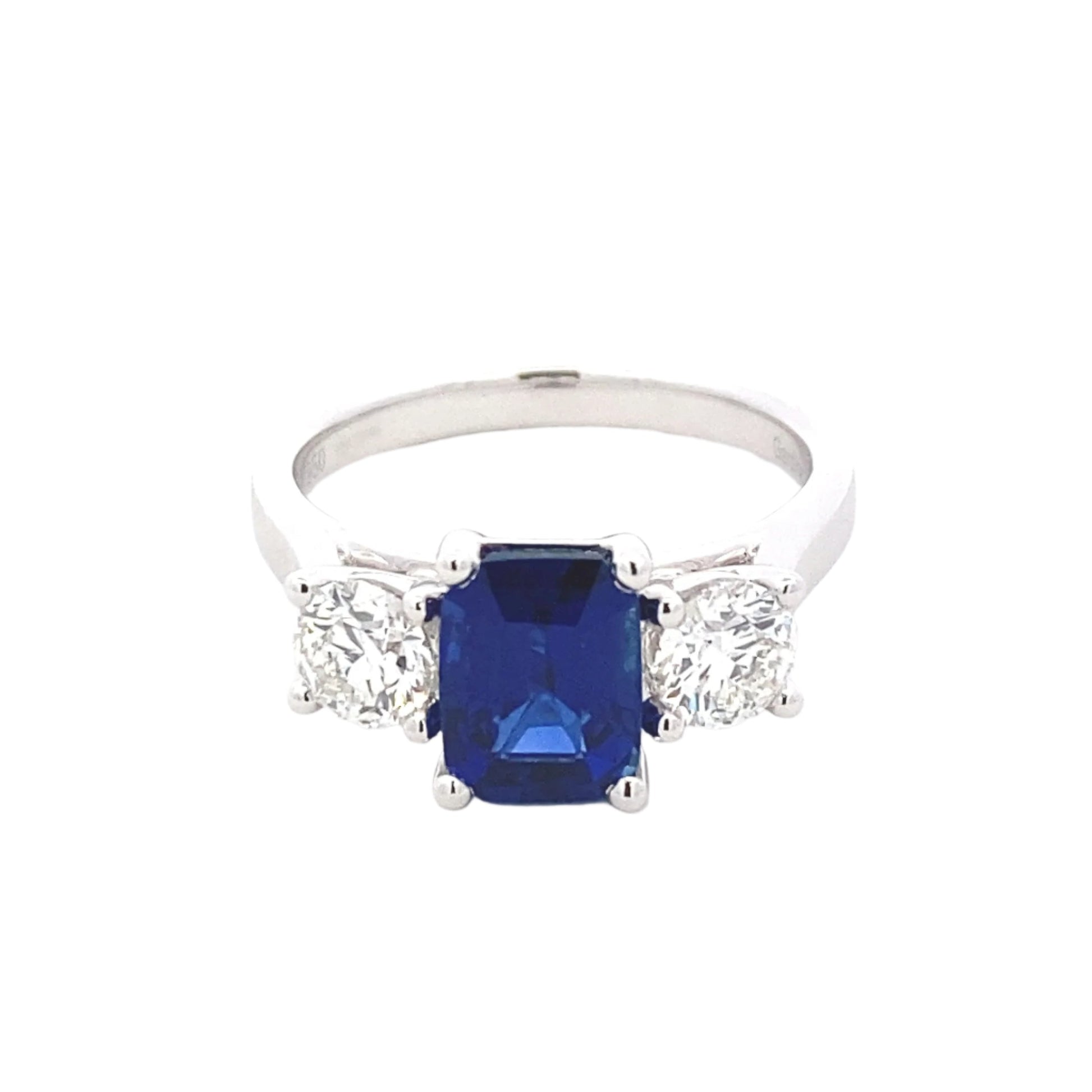 Octagonal Shaped Sapphire and round brilliant cut diamond 3 stone ring Gardiner Brothers