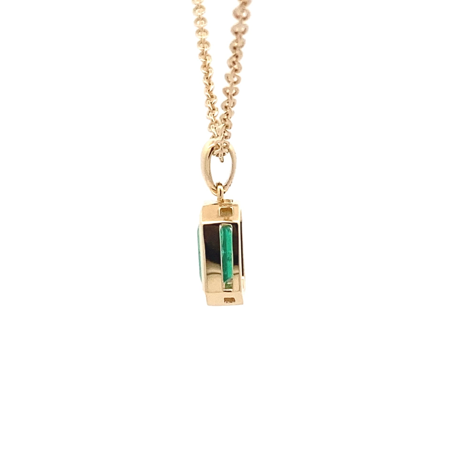 Octagonal Shaped emerald set in a yellow gold pendant Gardiner Brothers