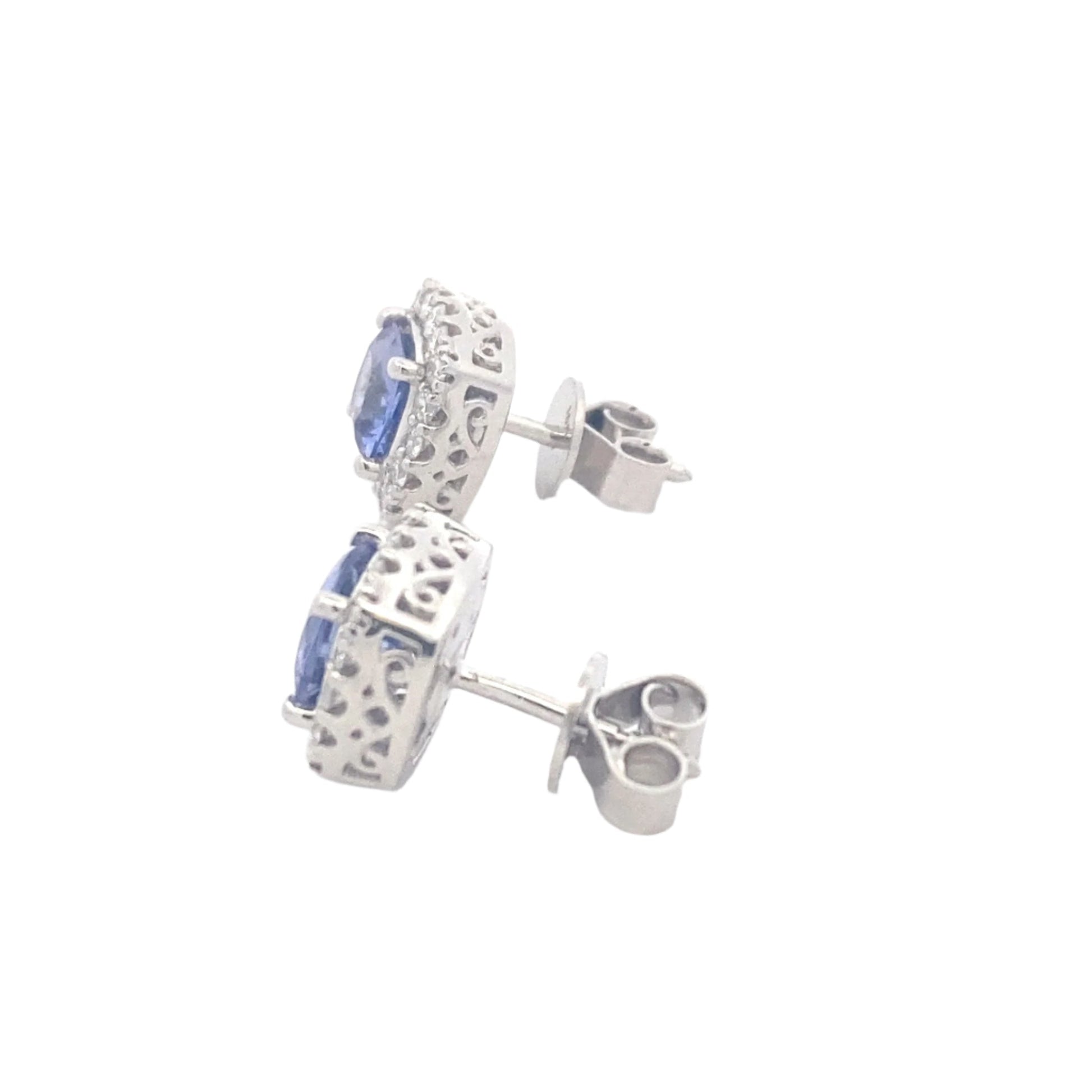 Cushion Shaped Tanzanite and round brilliant cut diamond halo earrings Gardiner Brothers