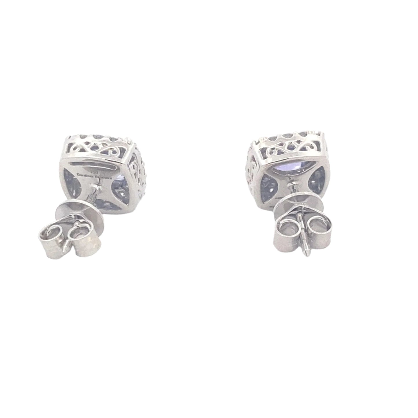 Cushion Shaped Tanzanite and round brilliant cut diamond halo earrings Gardiner Brothers