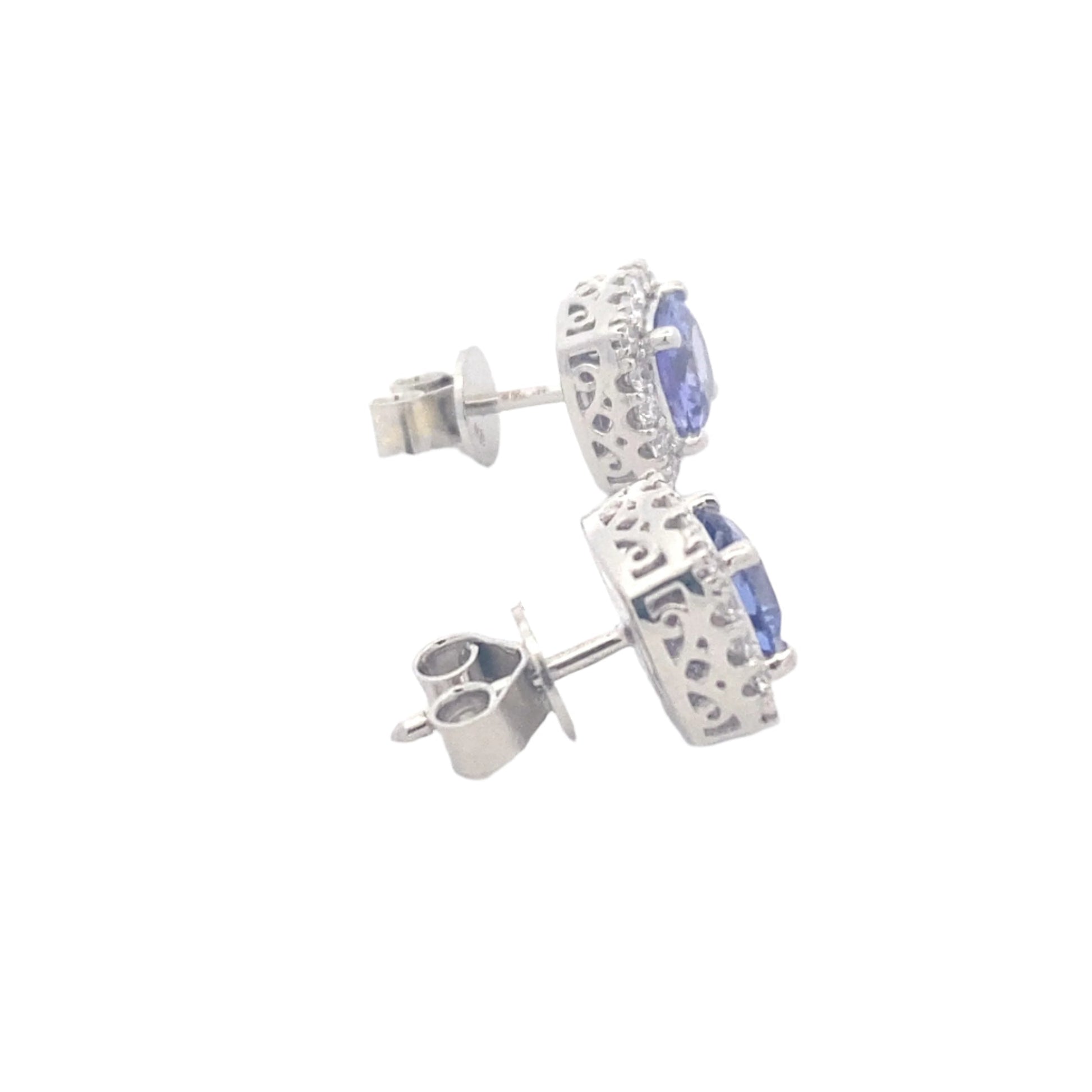 Cushion Shaped Tanzanite and round brilliant cut diamond halo earrings Gardiner Brothers