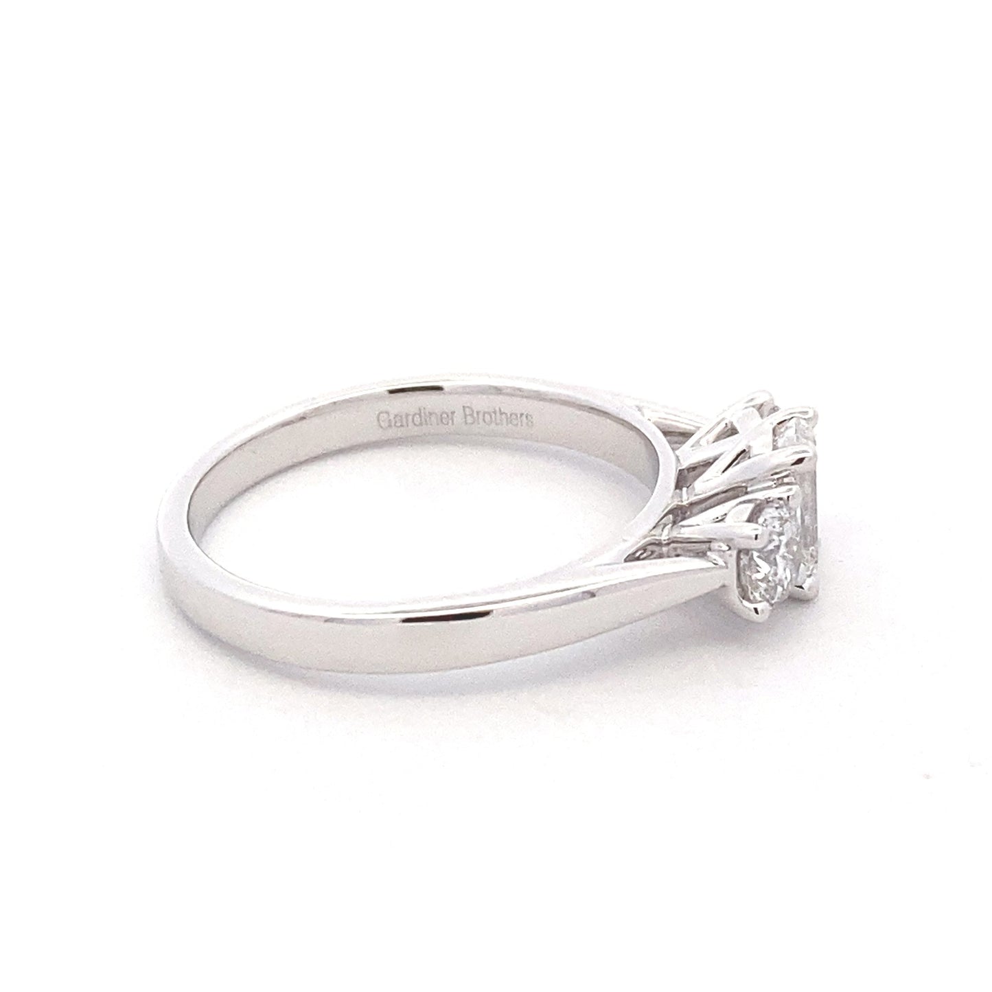 Platinum Emerald and round brilliant cut diamond 3 stone ring - 1.00cts Gardiner Brothers