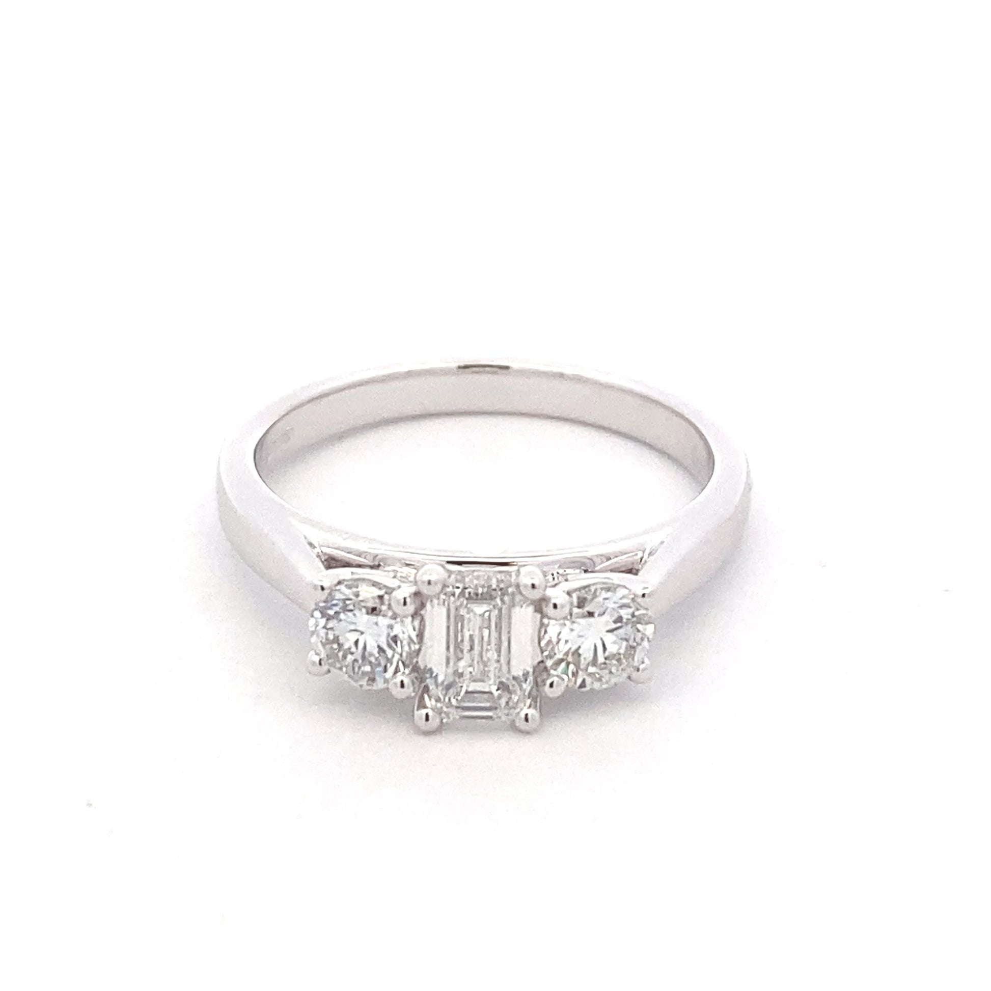 Platinum Emerald and round brilliant cut diamond 3 stone ring - 1.00cts Gardiner Brothers