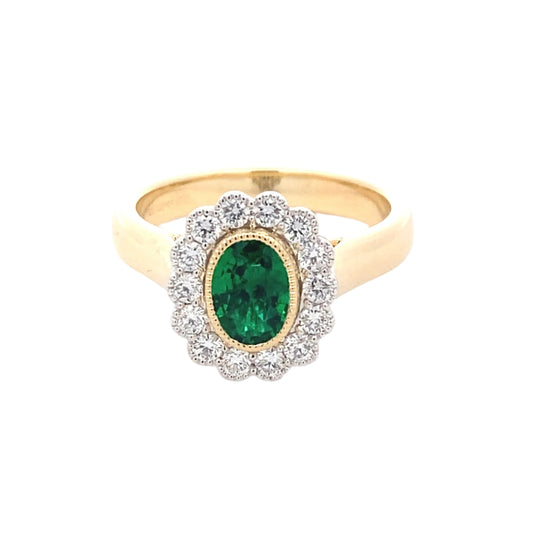 Oval emerald and round brilliant cut diamond vintage style cluster ring Gardiner Brothers