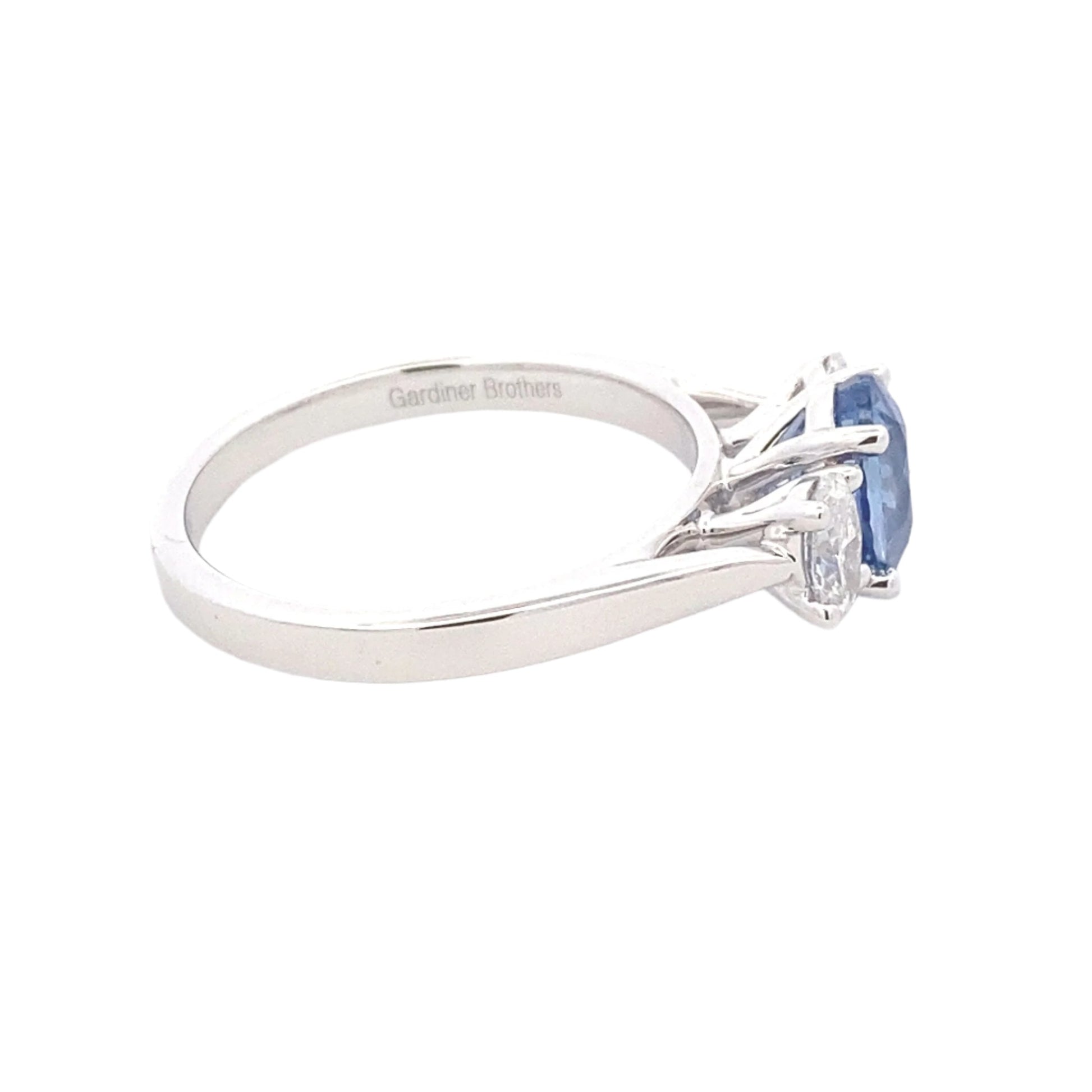 Oval Shaped Ceylon Sapphire and oval diamond 3 stone ring Gardiner Brothers