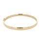Yellow gold 5mm solid bangle with a court profile Gardiner Brothers