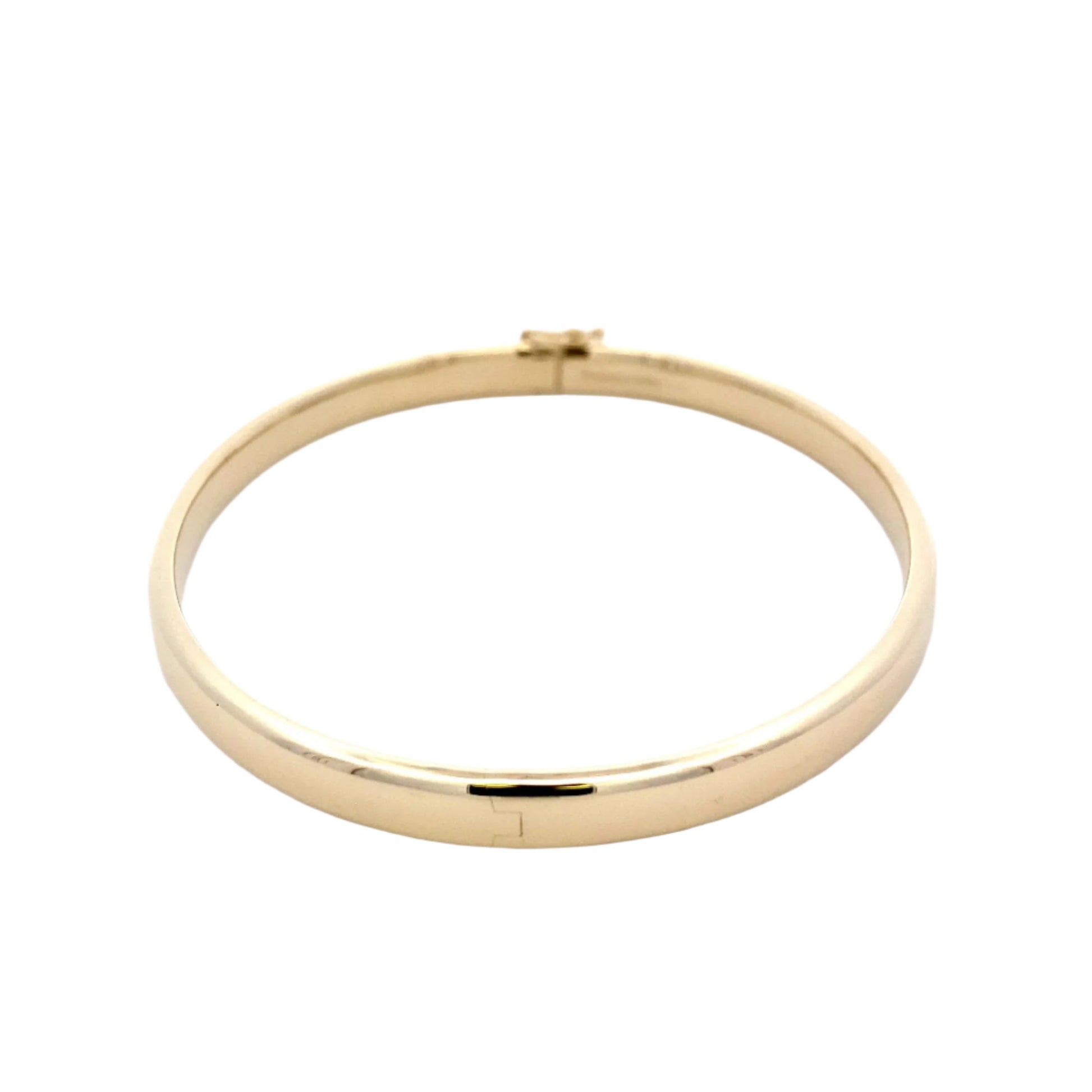 Yellow gold 5mm solid bangle with a court profile Gardiner Brothers