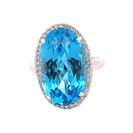 Oval Swiss Blue Topaz and Diamond Halo Ring Gardiner Brothers