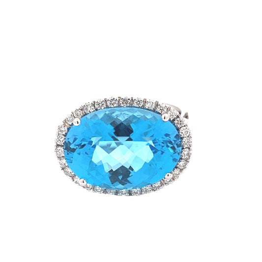 Oval Swiss Blue Topaz and Diamond Halo Ring Gardiner Brothers