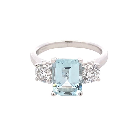Octagonal shaped aquamarine and round brilliant cut diamond 3 stone ring Gardiner Brothers