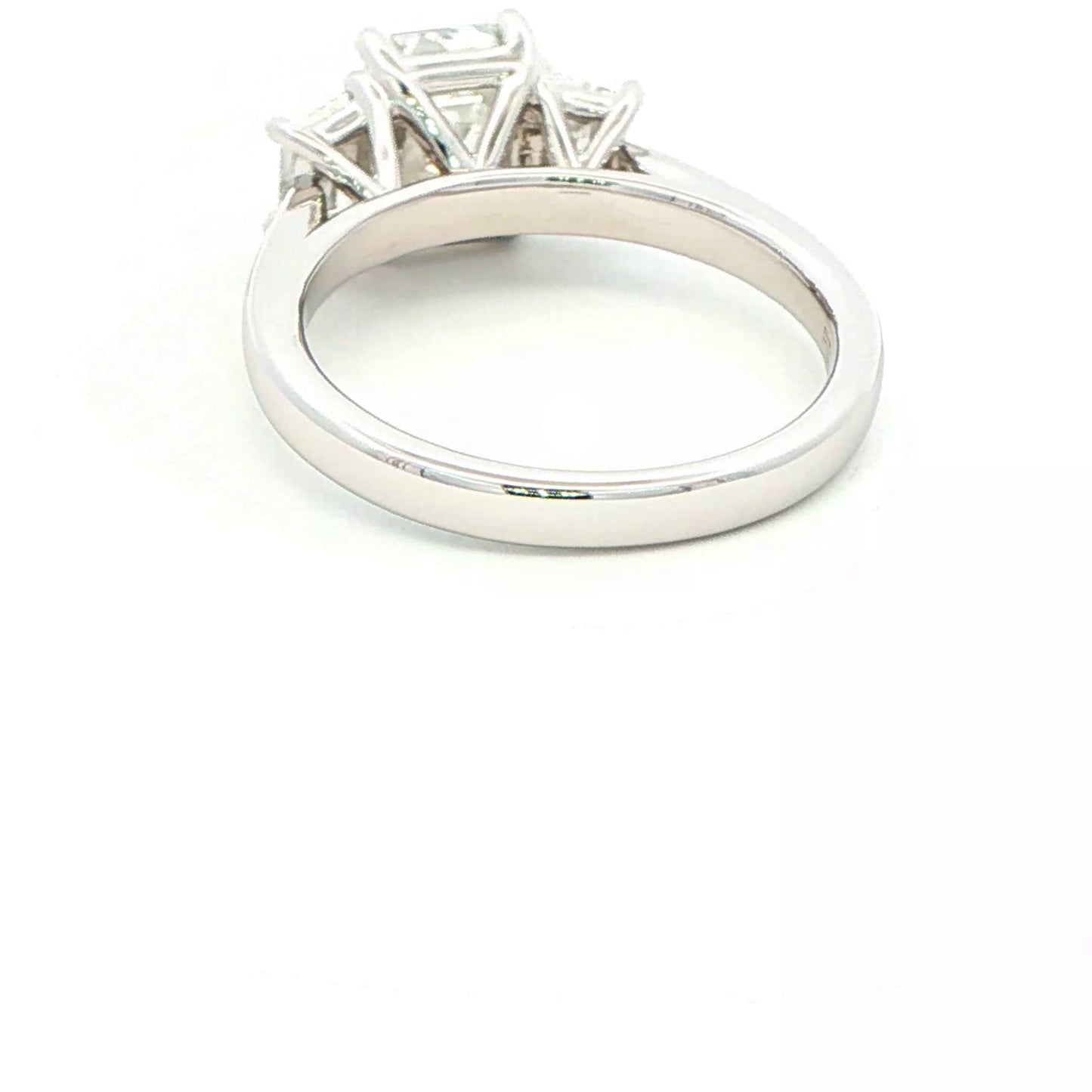 Platinum Emerald and Trapezoid cut diamond 3 stone ring - 2.00cts Gardiner Brothers