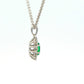 Oval Shaped emerald and round brilliant cut diamond cluster pendant
