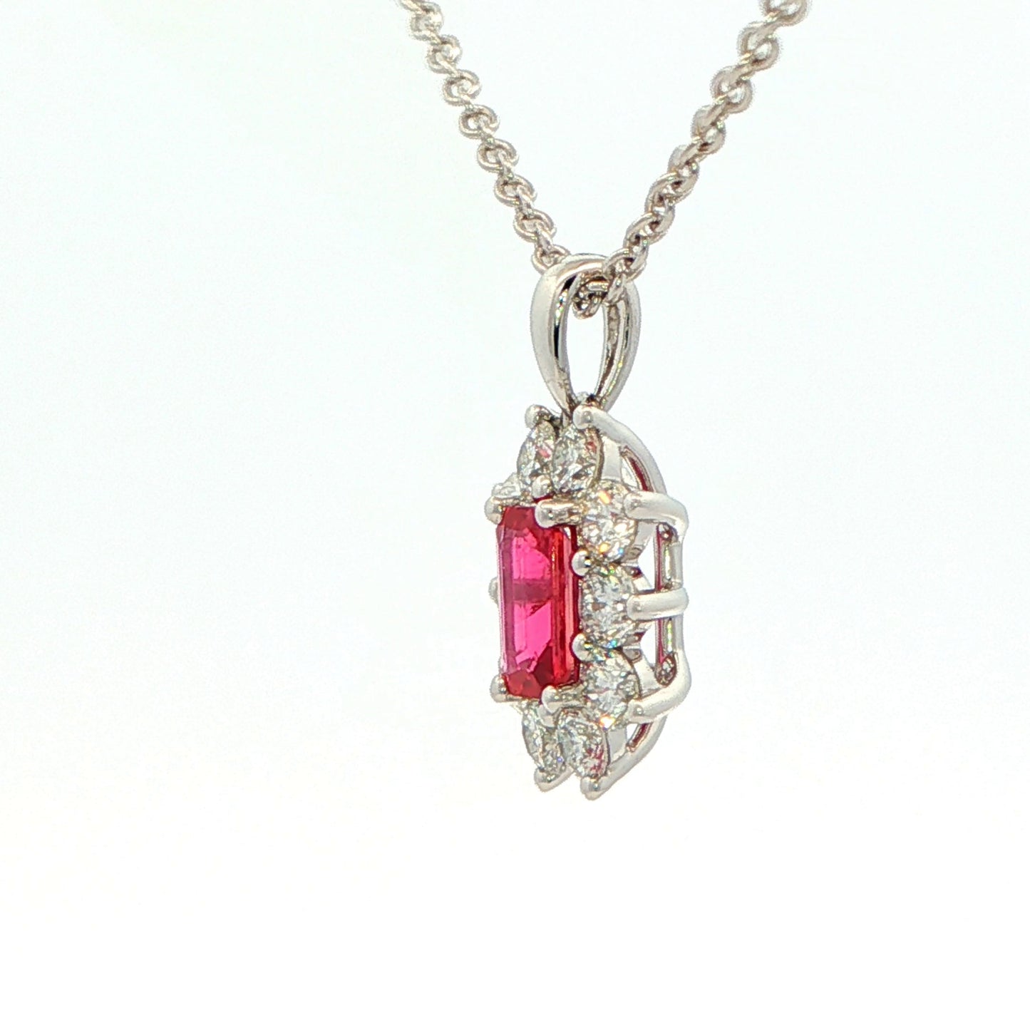 Octagonal shaped Ruby and round brilliant cut diamond cluster style pendant