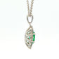 Oval shaped emerald and round brilliant cut diamond cluster pendant