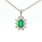 Octagonal shaped emerald and round brilliant cut diamond cluster pendant