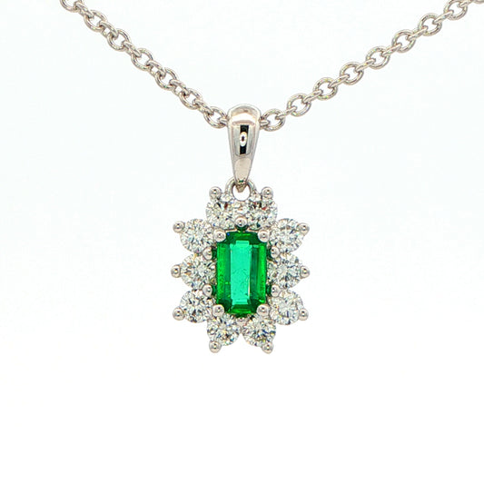 Octagonal shaped emerald and round brilliant cut diamond cluster pendant