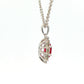Oval shaped ruby and round brilliant cut diamond cluster style pendant