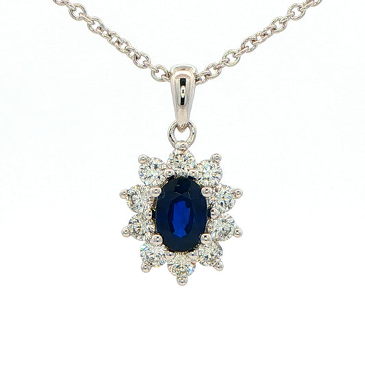 Oval shaped sapphire and round brilliant cut diamond cluster style pendant