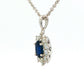 Oval shaped sapphire and round brilliant cut diamond cluster style pendant
