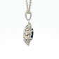 Oval shaped sapphire and round brilliant cut diamond cluster style pendant