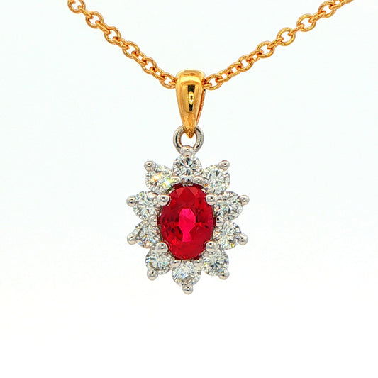 Oval shaped ruby and round brilliant cut diamond cluster style pendant