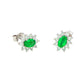 Oval shaped emerald and round brilliant cut diamond cluster style earrings