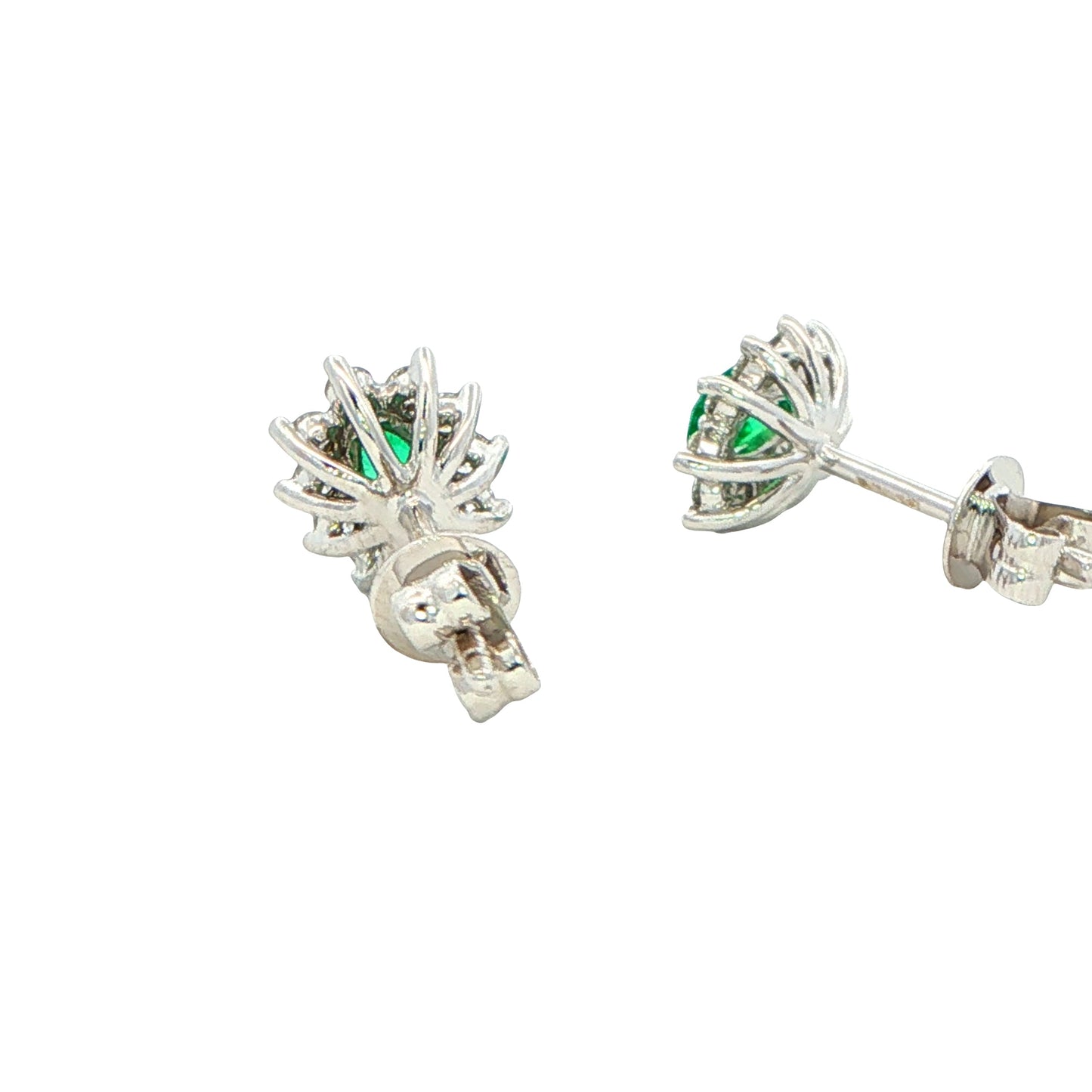 Oval shaped emerald and round brilliant cut diamond cluster style earrings