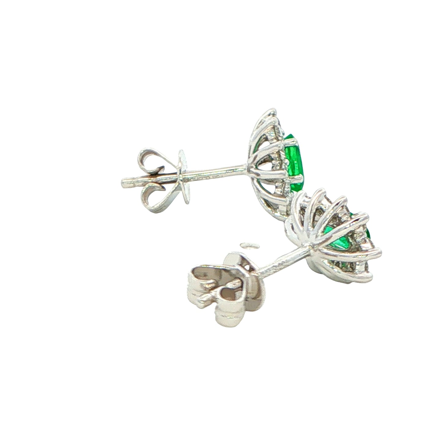 Oval shaped emerald and round brilliant cut diamond cluster style earrings
