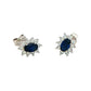 Oval shaped sapphire and round brilliant cut diamond cluster style earring
