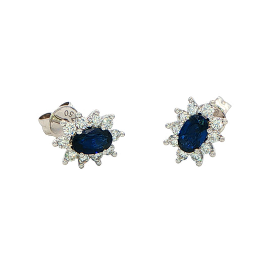Oval shaped sapphire and round brilliant cut diamond cluster style earring