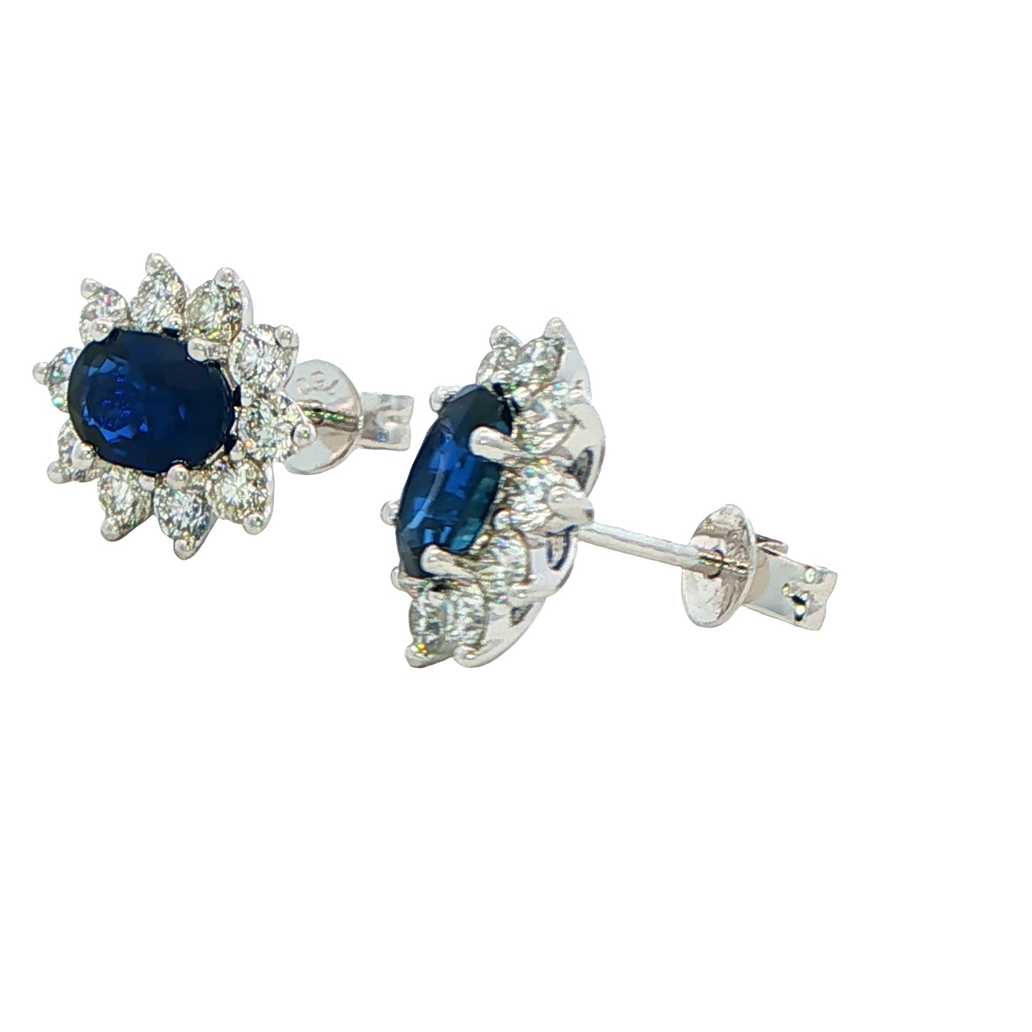 Oval shaped sapphire and round brilliant cut diamond cluster style earrings